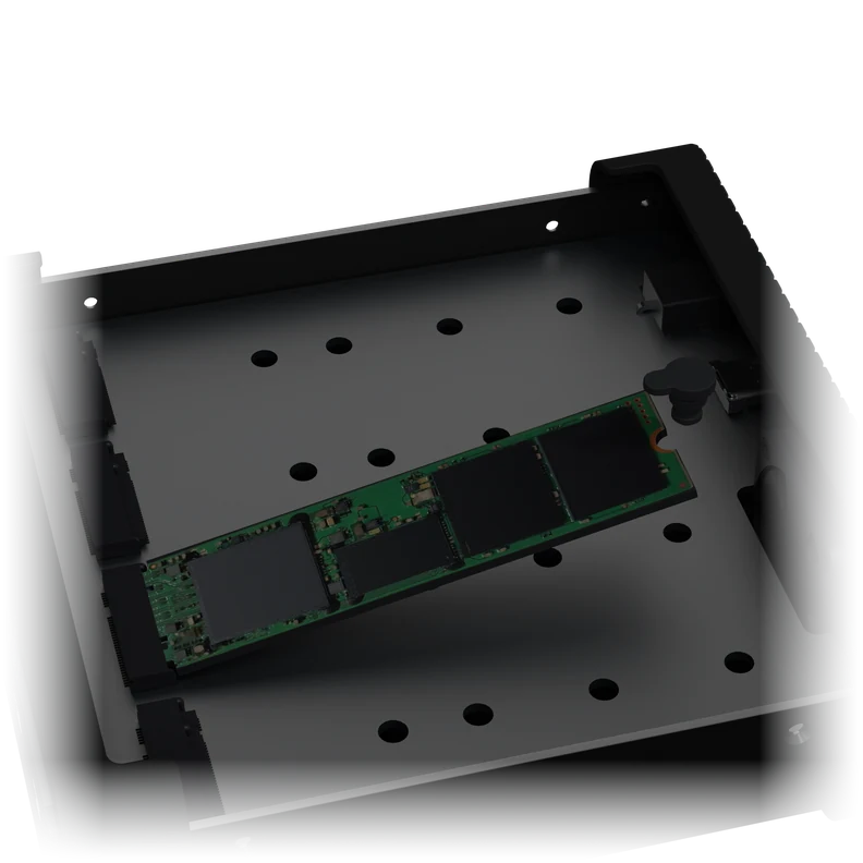 Close-up of the tray: an M.2 SSD angled into the slot, with the plug at its end