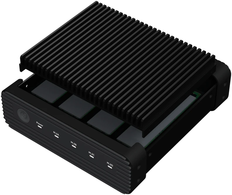 Tray with the finned heatsink back on the SSDs, fixed with screws at the side