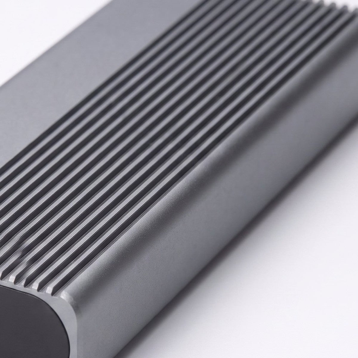 Macro shot of the ridged aluminium cooling fins on the Switss M.2 enclosure