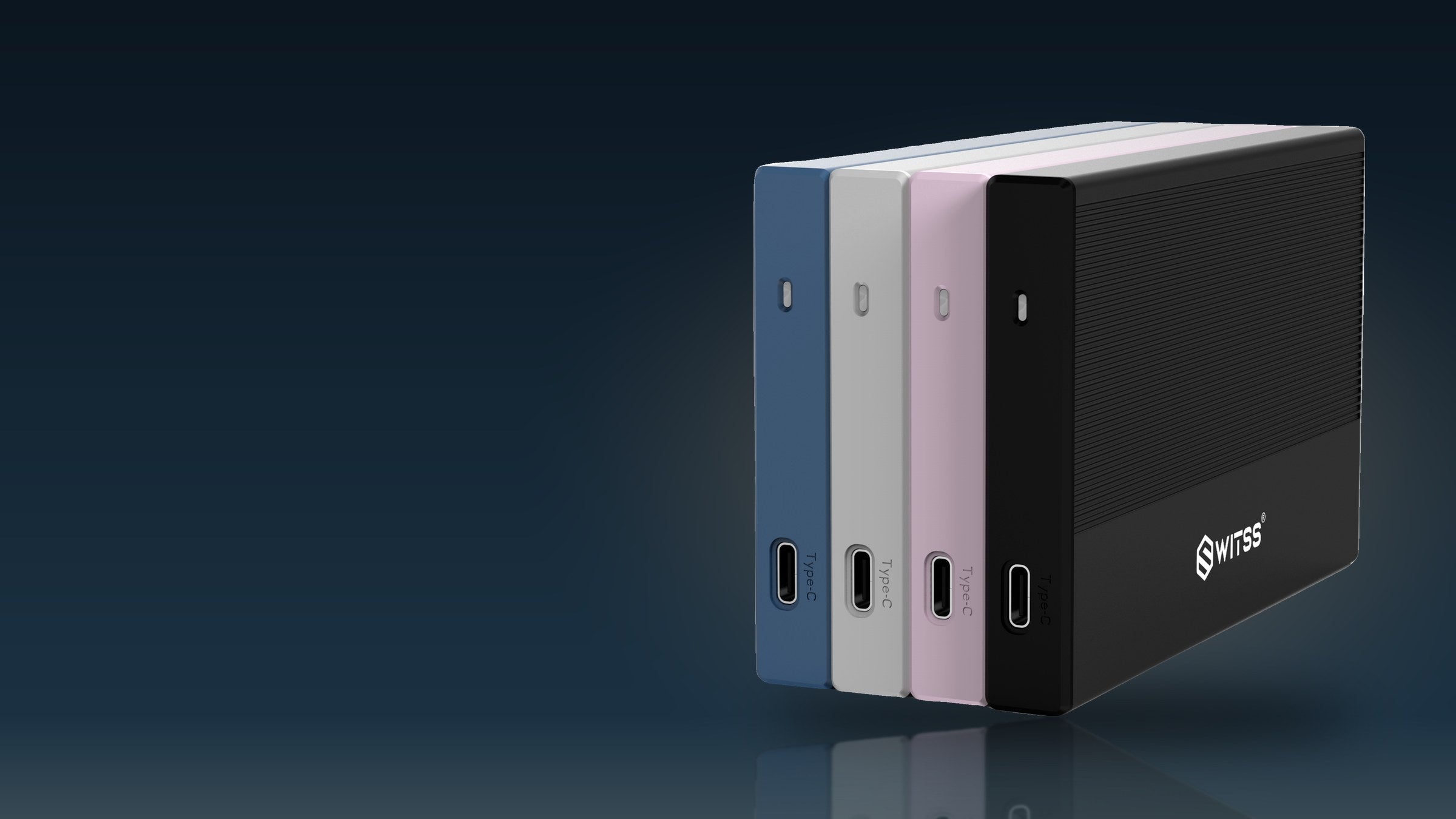 Switss® 2,5 inch behuizing in vier kleuren, rechtop in een donkere studio met warm licht